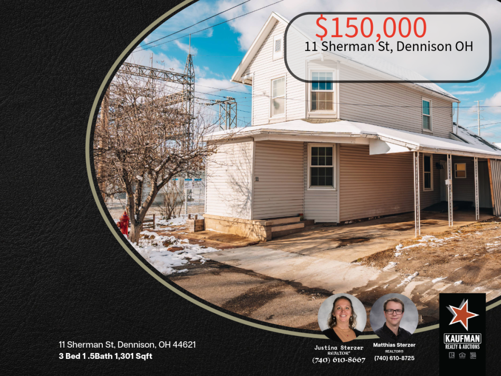 Two-story home at 11 Sherman Street, Dennison, Ohio featuring a covered car port and paved driveway.
