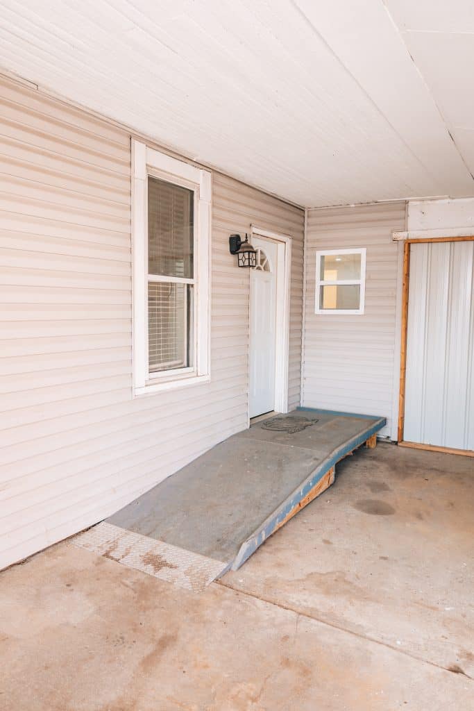 Covered Carport with entry ramp at 11 Sherman Street, Dennison, Ohio home.
